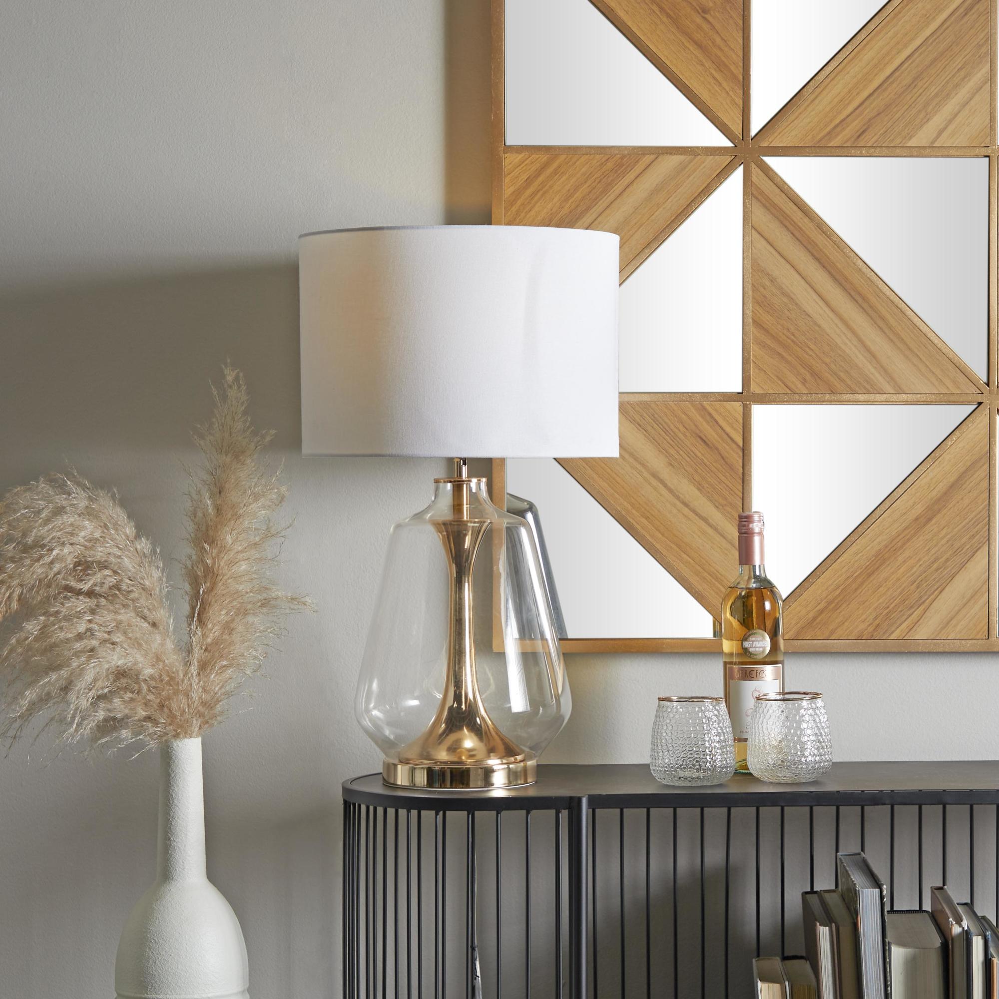 CosmoLiving by Cosmopolitan Gold Tempered Glass Transparent Base Room Table Lamp with Drum Shade