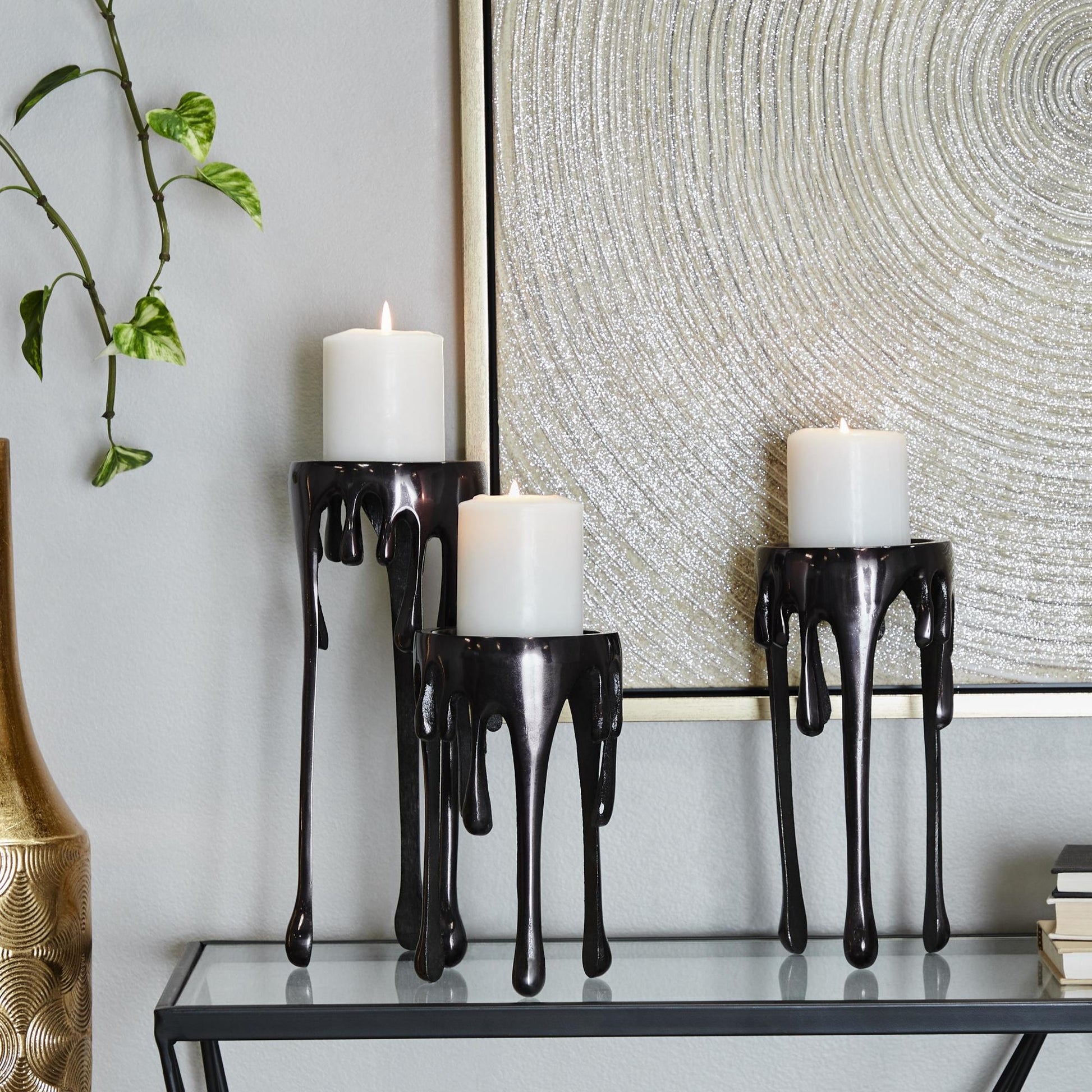 CosmoLiving by Cosmopolitan Set of 3 Abstract Aluminum Metal Drip Decorative Candle Holder with Melting Designed Legs