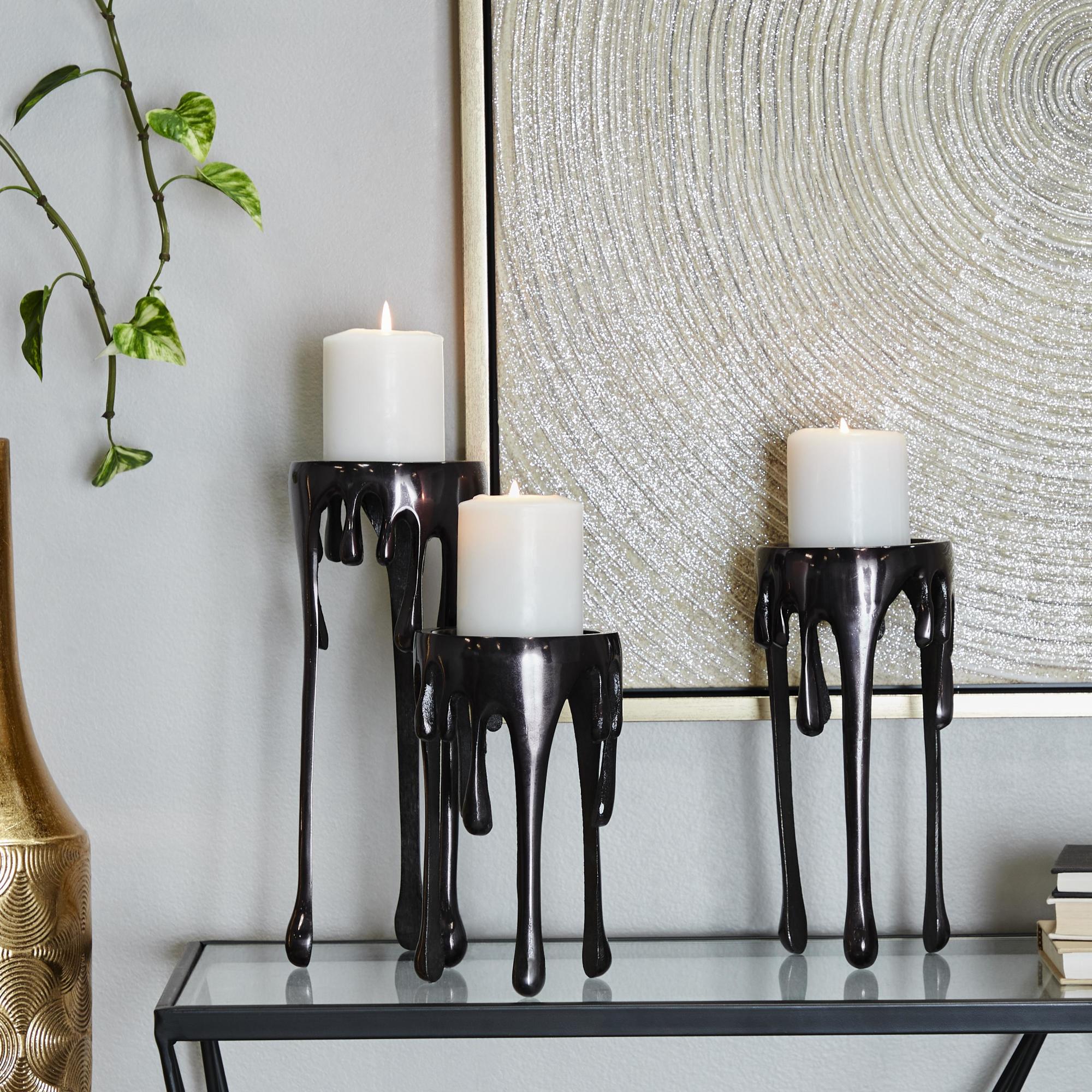 CosmoLiving by Cosmopolitan Set of 3 Abstract Aluminum Metal Drip Decorative Candle Holder with Melting Designed Legs