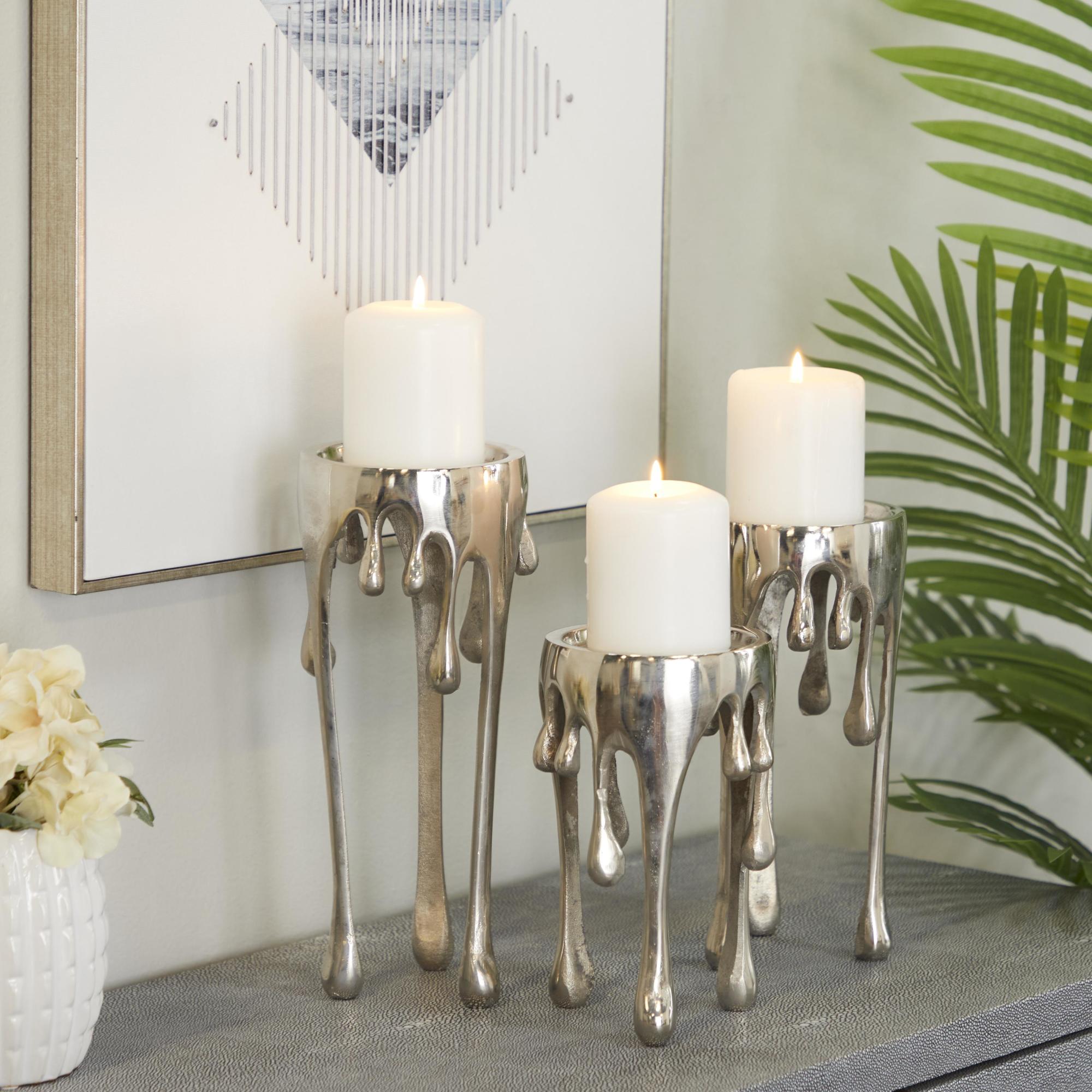 CosmoLiving by Cosmopolitan Set of 3 Abstract Aluminum Metal Drip Decorative Candle Holder with Melting Designed Legs