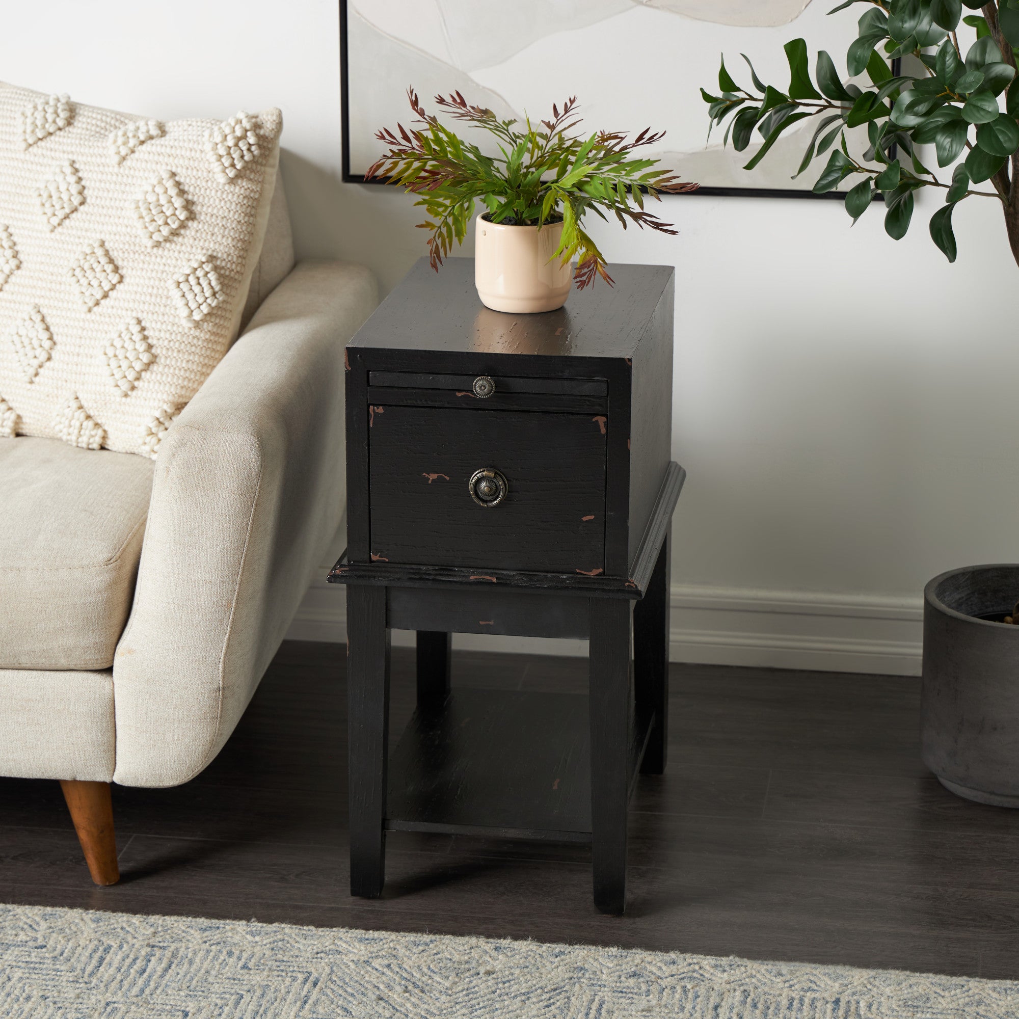 Black Wooden Distressed 1 Drawer Room Accent Table with Sliding Shelf and Silver Floral Ring Handle