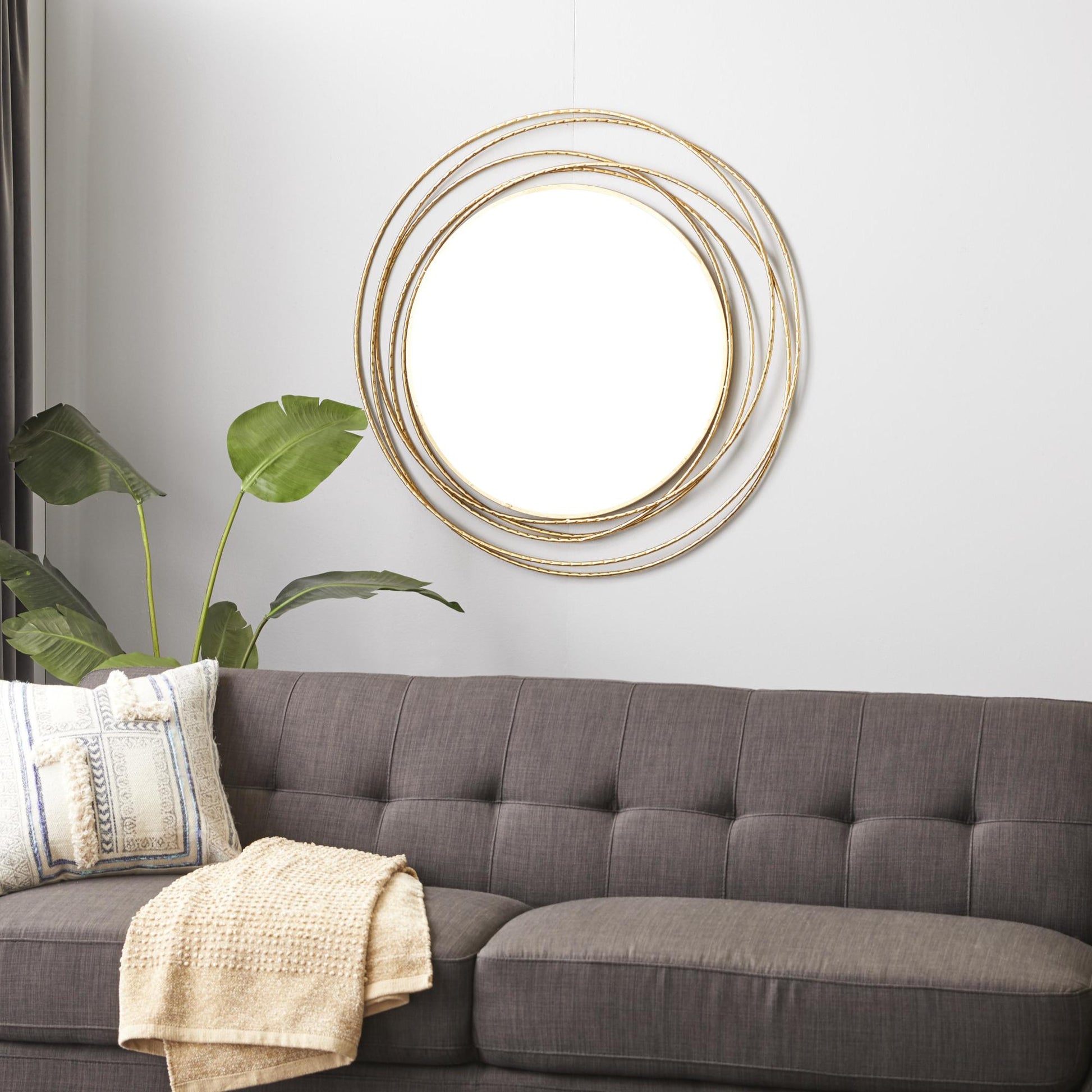Gold Metal Room Wall Mirror with Overlapping Ring Frame