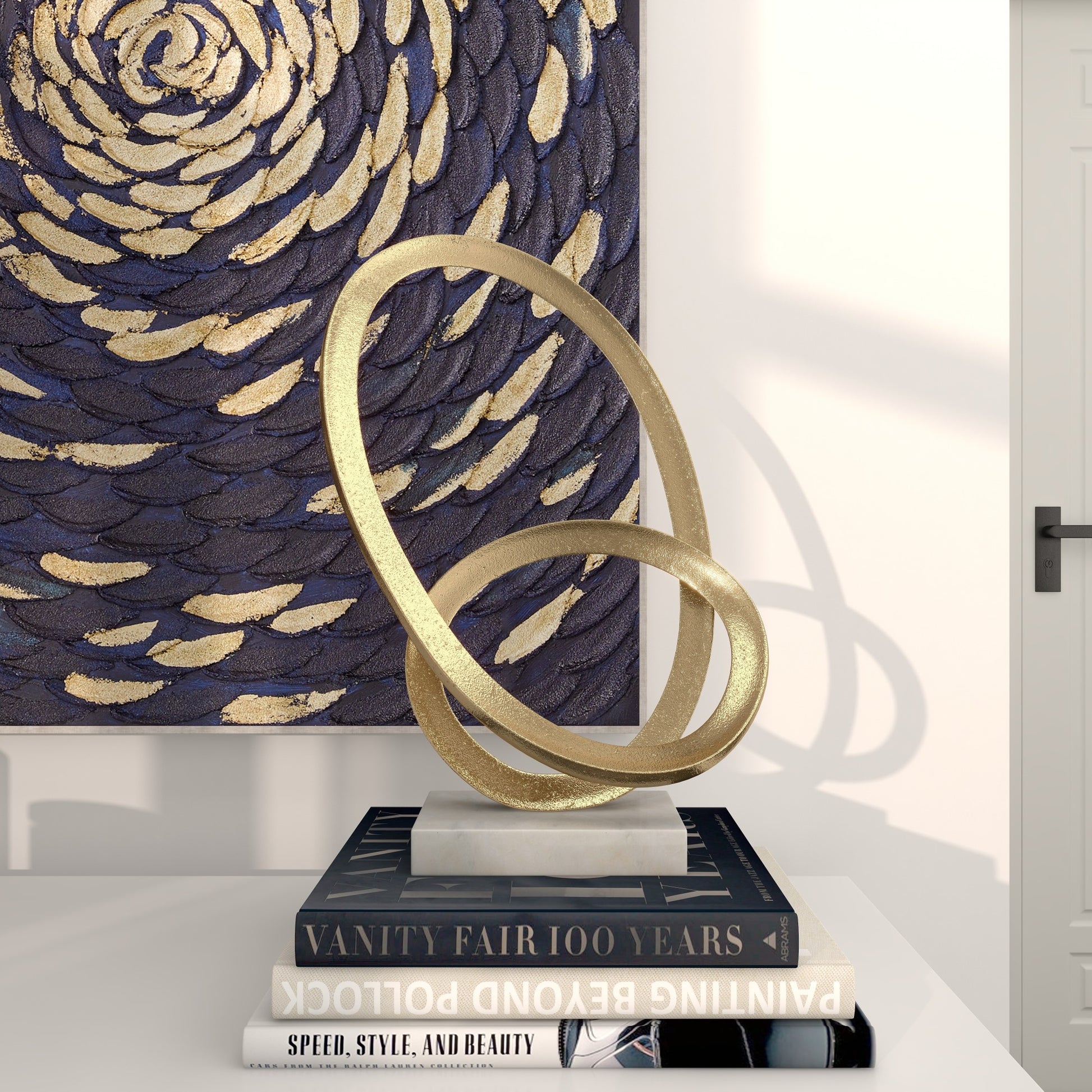 CosmoLiving by Cosmopolitan Geometric Gold Aluminum Metal Loop Decorative Sculpture with Marble Base