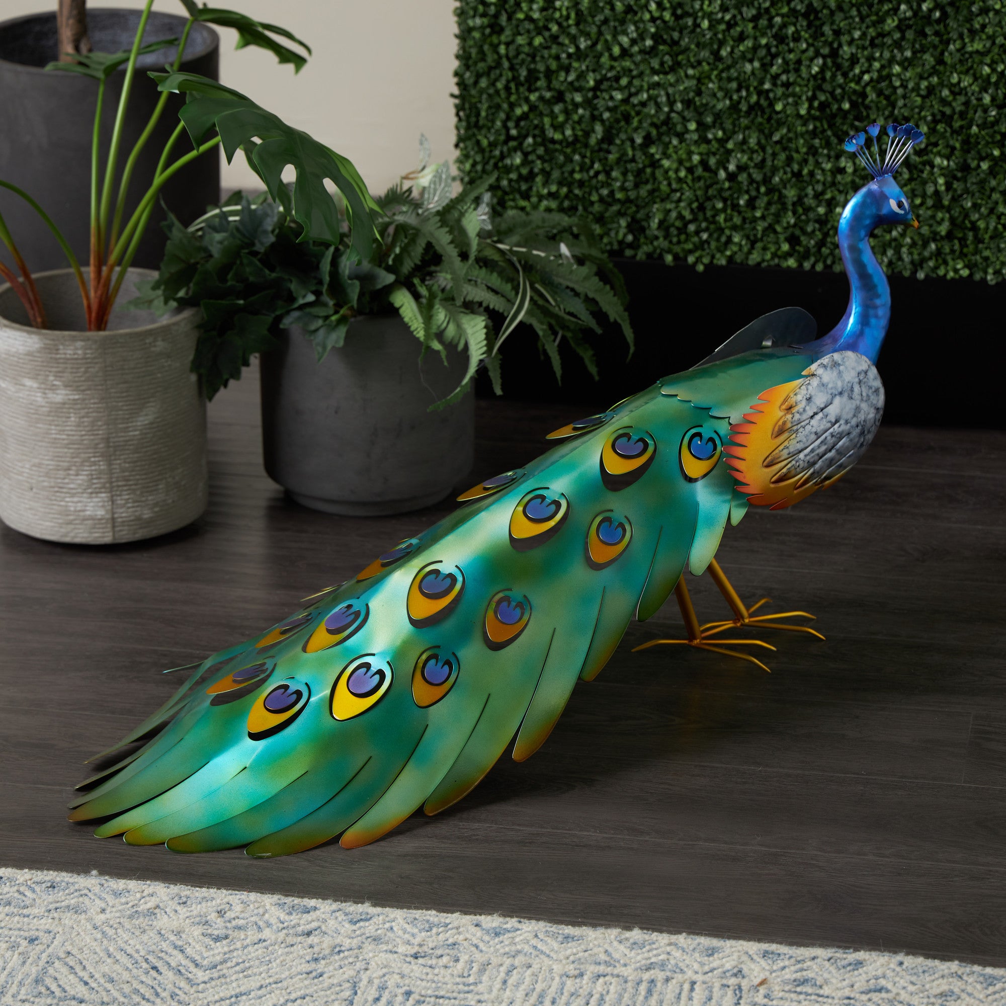 Peacock Blue Metal Decorative Garden Sculpture with Gold Legs and Teal Wings