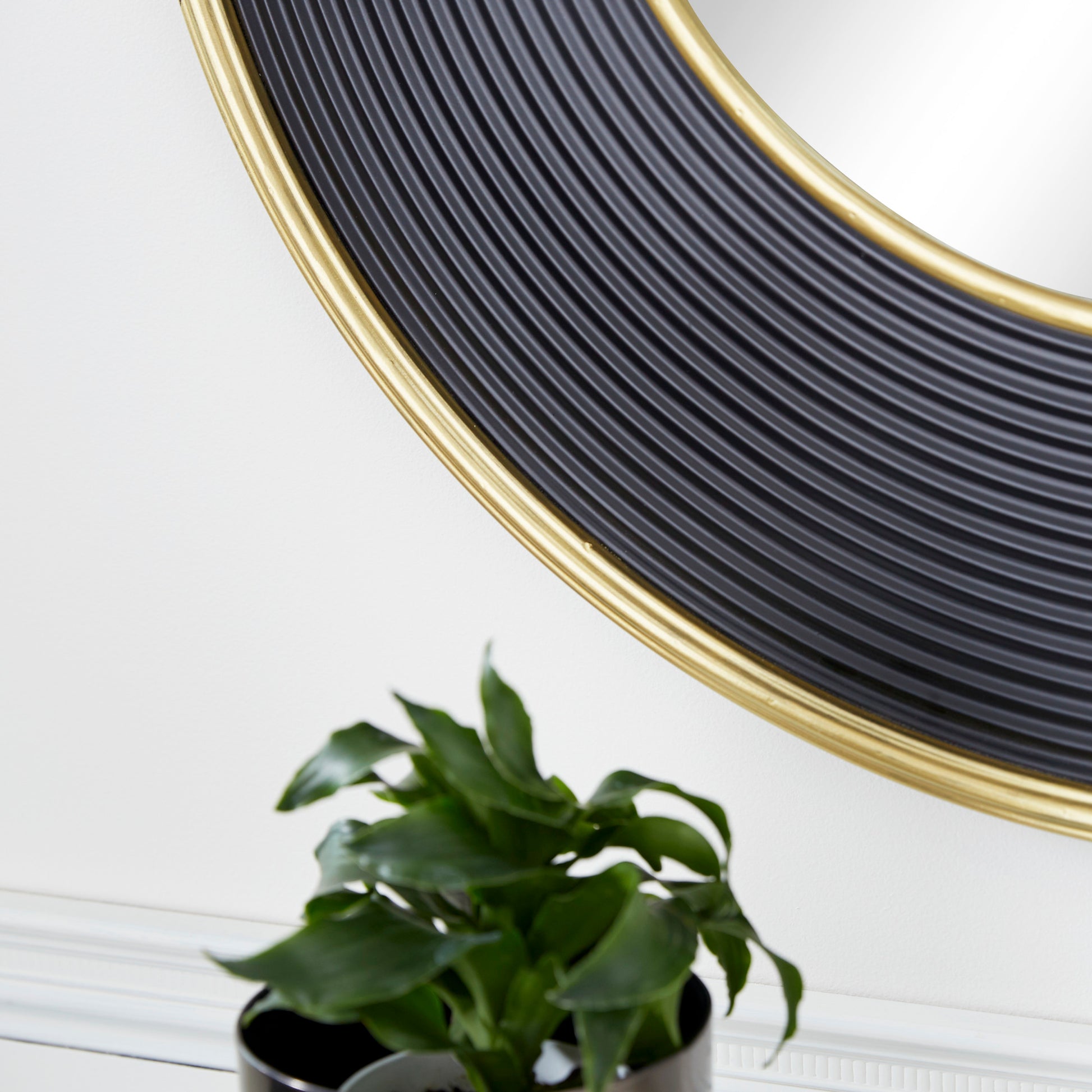 CosmoLiving by Cosmopolitan Black Metal Ribbed Room Wall Mirror with Gold Edges