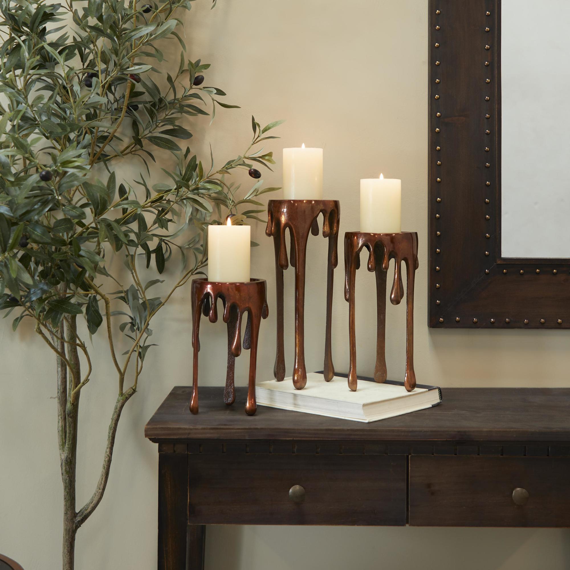 CosmoLiving by Cosmopolitan Set of 3 Abstract Aluminum Metal Drip Decorative Candle Holder with Melting Designed Legs