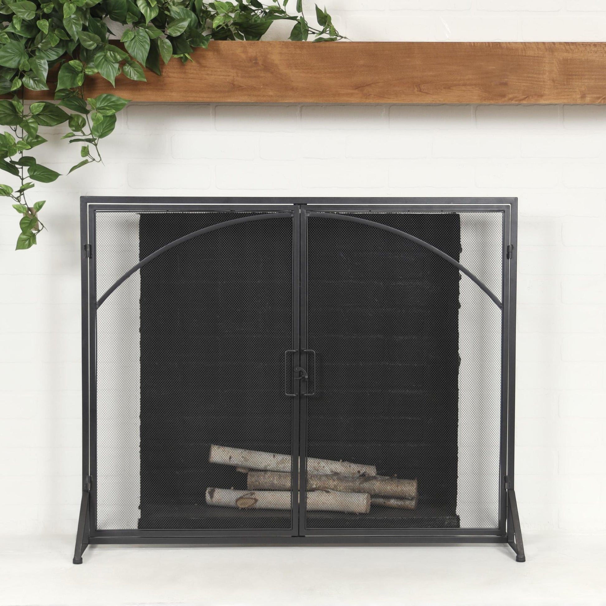 Black Metal Single Panel Living Room Fireplace Screen with Arch Inspired Doors and Handles